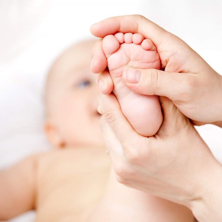 Benefits of Baby Massage - Mother Massaging Baby's Foot