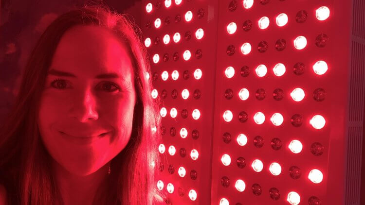 Mama Natural using her Joovv Light red light therapy quad