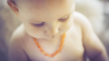 amber teething necklace on ankle